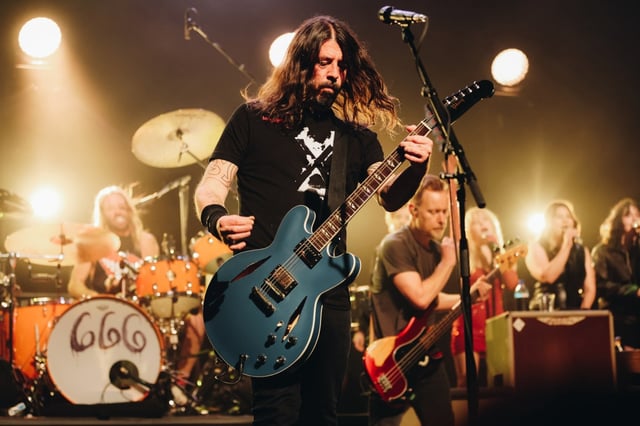 HOLLYWOOD, CALIFORNIA – FEBRUARY 16: (L-R) Taylor Hawkins, Dave Grohl and Nate Mendel of Foo Fighters performs onstage at the after party for the Los Angeles premiere of “Studio 666” at the Fonda Theatre on February 16, 2022 in Hollywood, California. (Photo by Rich Fury/Getty Images)