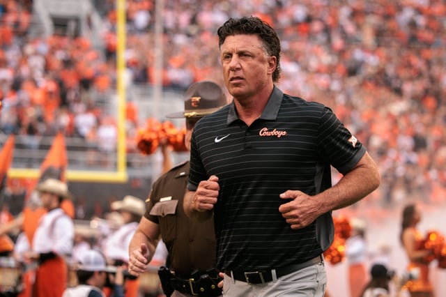 Aug 28, 2025; Stillwater, Oklahoma, USA; Oklahoma State Cowboys coach Mike Gundy takes the field prior to the game against the Tennessee Martin Skyhawks at Boone Pickens Stadium. Mandatory Credit: William Purnell-Imagn Images/File photo