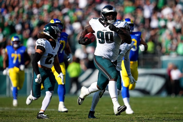 Jordan Davis #90 of the Philadelphia Eagles returns a blocked field goal for a touchdown against the Los Angeles Rams during the fourth quarter at Lincoln Financial Field on September 21, 2025 in Philadelphia, Pennsylvania.