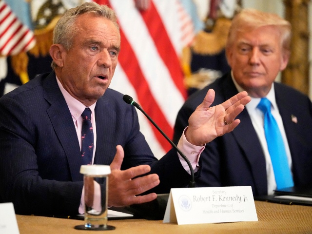 Health and Human Services Secretary Robert F. Kennedy Jr. speaks as President Donald Trump listens at an event to promote his proposal to improve Americans' access to their medical records in the East Room of the White House, Wednesday, July 30, 2025, in Washington. (AP Photo/Mark Schiefelbein)