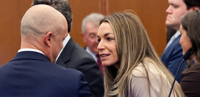Karen Read, right, talks with her lawyer Damon Seligson in the courtroom.....The Karen Read civil trial starts with a motion to dismiss in Plymouth Superior Court, Plymouth on..Monday Sept. 22, 2025..Pool photo by Greg Derr
