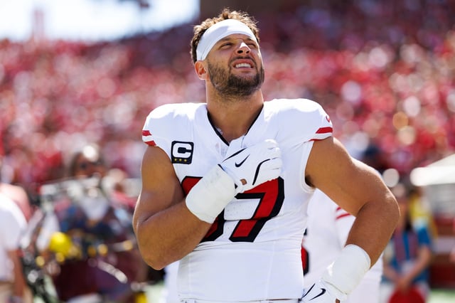 Nick Bosa #97 of the San Francisco 49ers stands on the sidelines during the national anthem prior to an NFL football game against the Arizona Cardinals at Levi's Stadium on September 21, 2025 in Santa Clara, California.