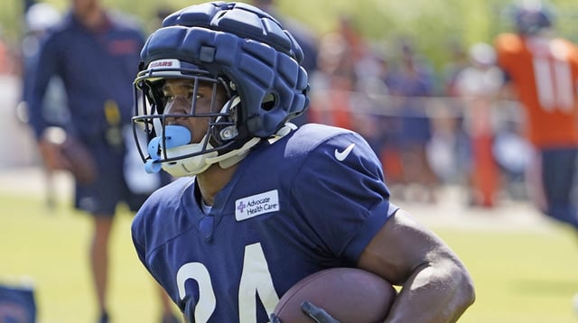 Jul 27, 2024; Lake Forest, IL, USA; Chicago Bears running back Khalil Herbert (24) runs with the ball during Chicago Bears Training Camp at Halas Hall. Mandatory Credit: David Banks-Imagn Images.