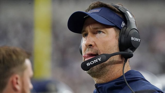 Sep 14, 2025; Arlington, Texas, USA; Dallas Cowboys head coach Brian Schottenheimer looks on during the first quarter at AT&T Stadium. Mandatory Credit: Raymond Carlin III-Imagn Images