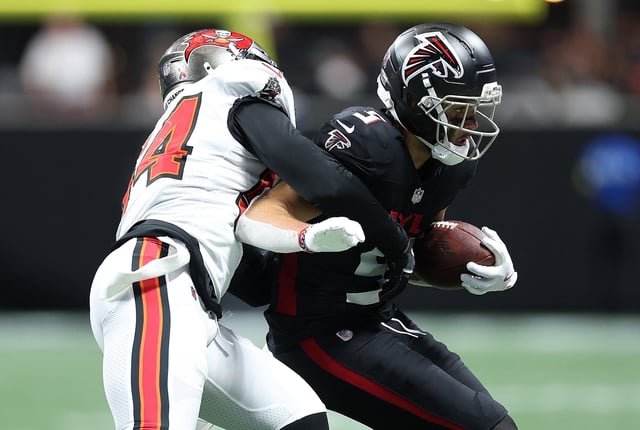 Drake London #5 of the Atlanta Falcons is tackled by Lavonte David #54 of the Tampa Bay Buccaneers during the second quarter of the NFL 2025 game between Tampa Bay Buccaneers and Atlanta Falcons at Mercedes-Benz Stadium on September 07, 2025 in Atlanta, Georgia.