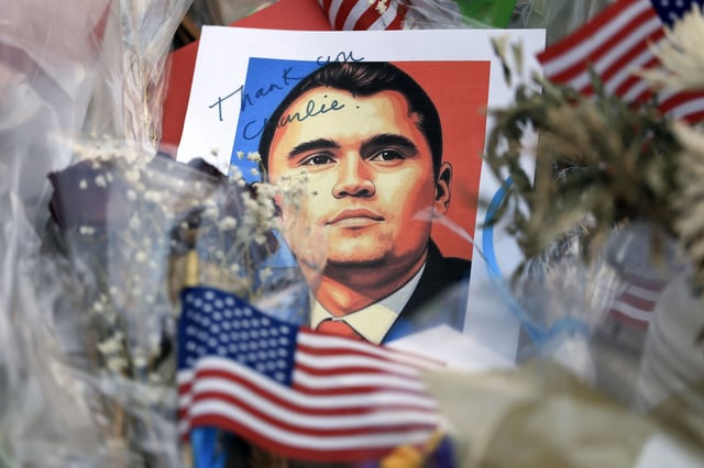 Items are displayed in the makeshift memorial for Charlie Kirk outside the headquarters of Turning Point USA on Thursday, Sept. 18, 2025, in Phoenix. Kirk, the CEO and co-founder of Turning Point USA, was shot and killed on Sept. 10 while speaking at an event for his "American Comeback Tour" at Utah Valley University.