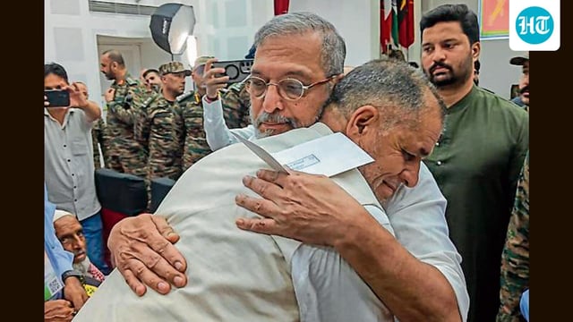 Bollywood actor Nana Patekar hugs a man during an event in Rajouri, Jammu and Kashmir, on Monday. (PTI)