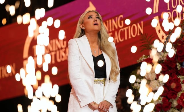 Erika Kirk reacts as she prepares to speak at a memorial for her husband, conservative activist Charlie Kirk, Sunday, Sept. 21, 2025, at State Farm Stadium in Glendale, Ariz.