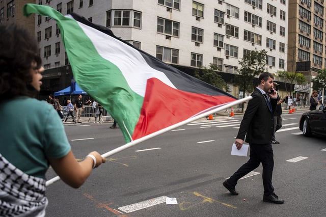 People protest the ongoing Israel-Palestine war outside the United Nations Headquarters during the 80th session of the UN General Assembly's discussion on a two-state solution, Monday, Sept. 22, 2025, in New York. (AP Photo/Angelina Katsanis)