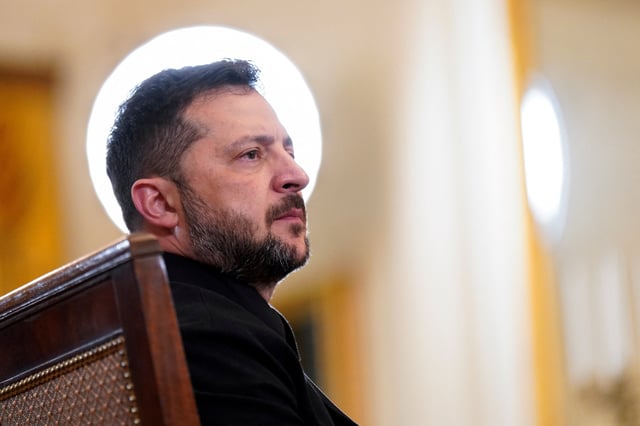 Ukrainian President Volodymyr Zelenskiy listens during a meeting with U.S. President Donald Trump and European leaders amid negotiations to end the Russian war in Ukraine, at the White House in Washington, D.C., U.S., August 18, 2025. REUTERS/Alexander Drago/File Photo