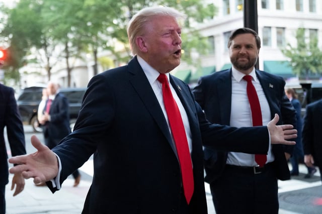 President Donald Trump, flanked by Vice President JD Vance, speaks to reporters outside a restaurant near the White House on Sept. 9, 2025, in Washington, DC.