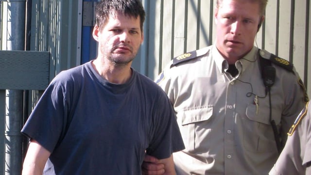 Randall Hopley, left, is led out of the Cranbrook, B.C. courthouse on Sept. 14, 2011. Hopley has been declared a long-term offender and faces a prison term with a period of supervision after his release. 