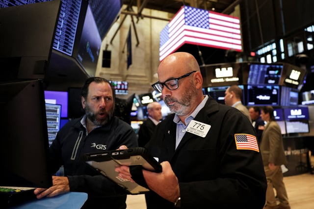 A trader works on the floor at the New York Stock Exchange (NYSE) in New York City, U.S., September 22, 2025. REUTERS/Jeenah Moon