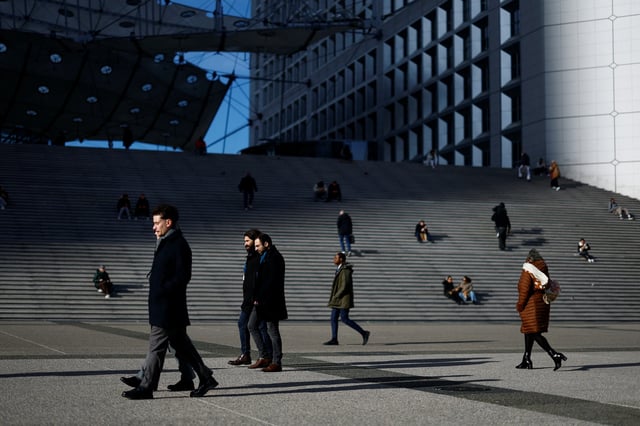 People walk on the esplanade of La Defense in the financial and business district of La Defense, near Paris, France, January 27, 2025. REUTERS/Sarah Meyssonnier