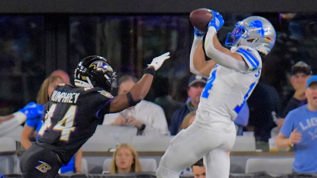 Lions wide receiver Amon-Ra St. Brown hauls in a touchdown catch against the Baltimore Ravens in Baltimore. (Karl Merton Ferron/Staff)