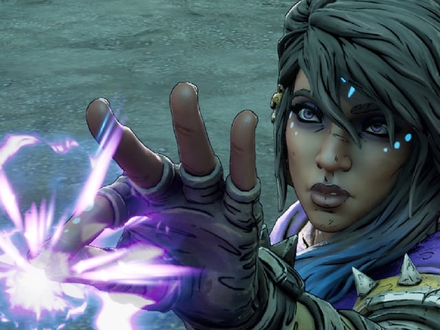 Amara holds a piece of siren magic between her fingertips in Borderlands 4.