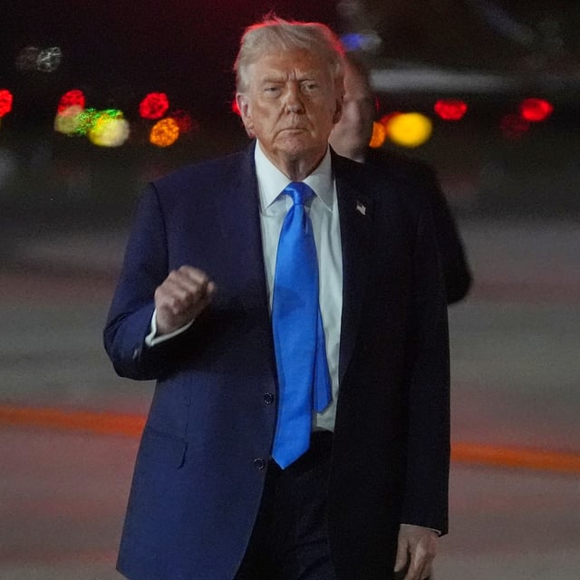 President Donald Trump gestures as he arrives on Air Force One at John F. Kennedy International Airport, Monday, Sept. 22, 2025, in New York. (AP Photo/Evan Vucci)