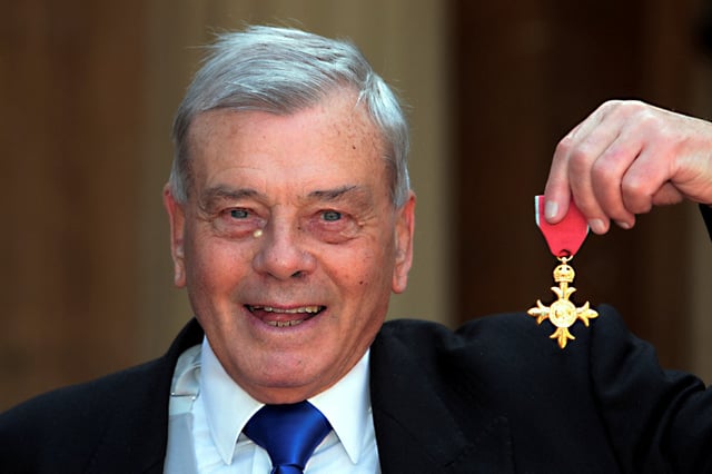 Former cricket umpire Harold "Dickie" Bird poses with his Officer of the Most Excellent Order of the British Empire (OBE) award after being knighted by Britain's Prince Charles at Buckingham Palace in London May 15, 2012.    REUTERS/Sean Dempsey/pool/File Photo