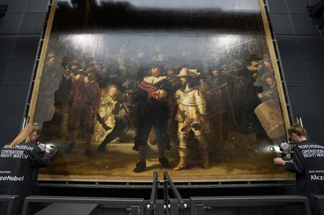 Art restorers work on Rembrandt's Night Watch at Amsterdam's Rijksmuseum, Netherlands, Tuesday, Sept. 23, 2025. (AP Photo/Peter Dejong)