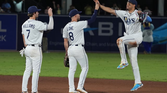 Sep 21, 2025; Tampa, Florida, USA; Tampa Bay Rays shortstop Carson Williams (7) (left), second base Brandon Lowe (8) (middle), and outfielder Christopher Morel (24) (right) celebrate after defeating the Boston Red Sox at George M. Steinbrenner Field. Mandatory Credit: Dave Nelson-Imagn Images