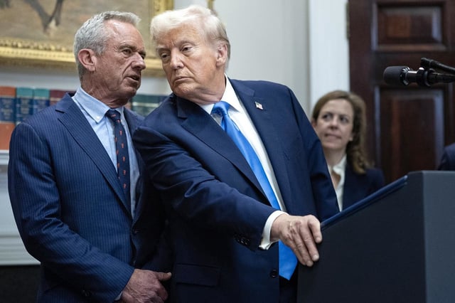 Health and Human Services Secretary Robert F. Kennedy Jr. speaks to President Donald Trump during a news conference on Sept. 22, 2025 at The White House.