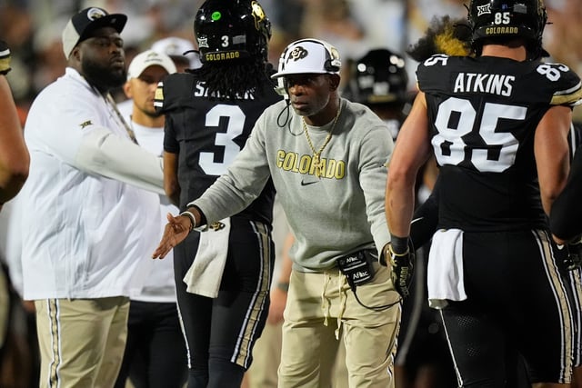 Colorado coach Deion Sanders celebrates a touchdown with his players against Wyoming at Folsom Field.