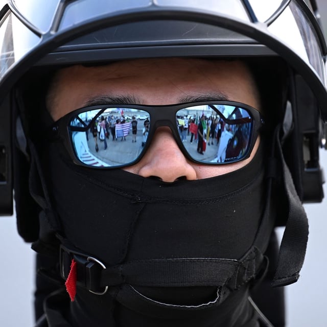 FILE - A U.S. Customs and Border Patrol agent looks on during a protest outside the Federal Building on June 13, 2025, in Los Angeles. (AP Photo/Wally Skalij, file)