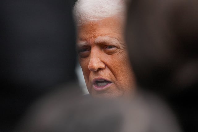 U.S. President Donald Trump speaks to the media before departing for a state visit to Britain, at the White House in Washington, D.C., U.S., September 16, 2025. REUTERS/Ken Cedeno/File Photo