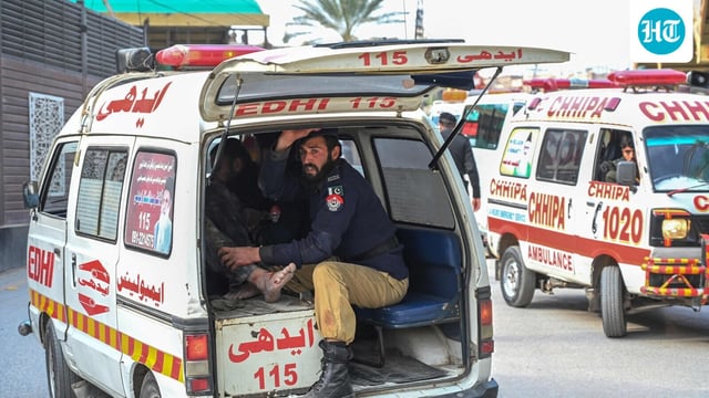 FILE - An ambulance transports injured blast victims outside the police headquarters in Peshawar. (Photo by Abdul MAJEED / AFP)