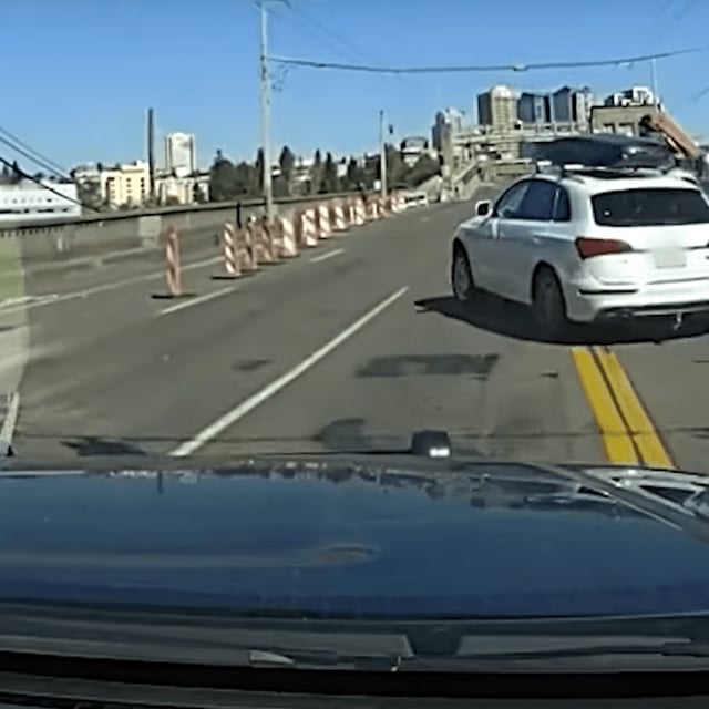 Seattle police{ }said a fleeing car jumped the gap on the partially lowered University District Bridge, went airborne, then landed on the other side of the bridge and continued north. (PHOTO: Seattle Police Department)