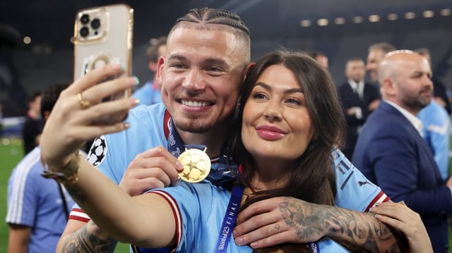 Phillips celebrates with partner Ashleigh Behan after City beat Inter to win the Champions League final in June 2023. The couple are expecting their second child