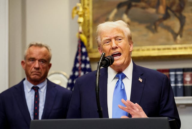 U.S. President Donald Trump, next to U.S. Secretary of Health and Human Services Robert F. Kennedy Jr., makes an announcement linking autism to childhood vaccines and to the use of popular pain medication Tylenol for pregnant women and children, claims which are not backed by decades of science, at the White House, in Washington, D.C., U.S., September 22, 2025. REUTERS/Kevin Lamarque