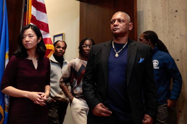 Mayor Michelle Wu and Alan Swanson arrive for a press conference and public apology to Swanson and Willie Bennett at City Hall in Boston on Dec. 20, 2023.