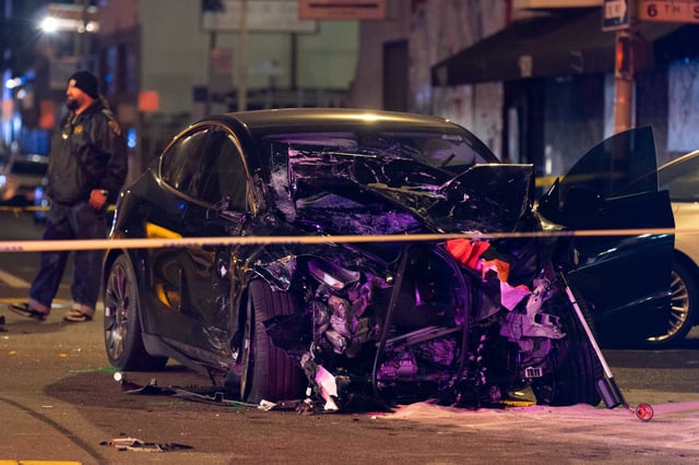 A Tesla rests at a crash scene at Sixth and Harrison streets in San Francisco on Sunday, Jan. 19, 2025. The driver of the Tesla, who was charged with felony manslaughter, will be able to leave custody ahead of trial, a judge ruled. 