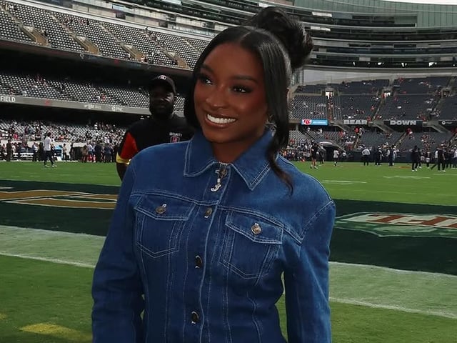 Simone Biles attended her husband's football game in the ultimate game day look: a denim skirt set, custom boots, and a Chanel bag