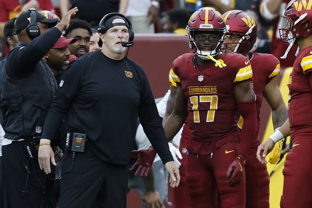 Sep 21, 2025; Landover, Maryland, USA; Washington Commanders head coach Dan Quinn (L) stands with Commanders wide receiver Terry McLaurin (17) on the sidelines against the Las Vegas Raiders during the third quarter at Northwest Stadium. Mandatory Credit: Geoff Burke-Imagn Images