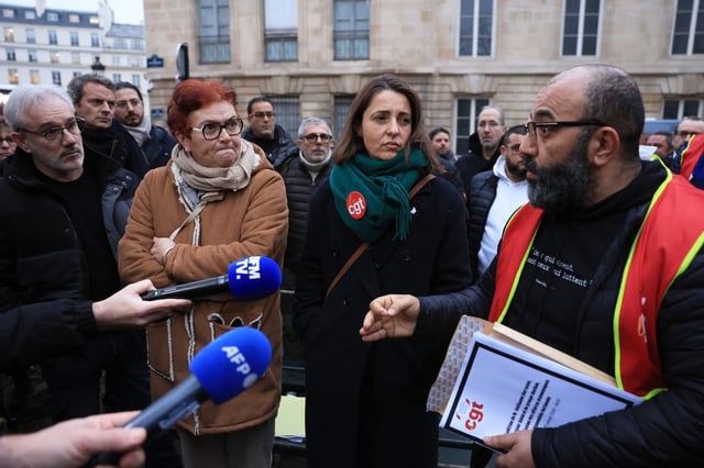 Les délégués syndicaux Gérald Villeroy (Auchan Retail France), Sophie Serra (UES Exploitation Auchan France), Sophie Binet (CGT) et Amar Lagha (Fédération CGT commerce-distribution), le 22 janvier lors d'une manifestation à Paris.