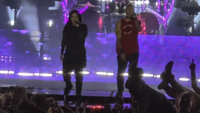 A photo of Evanescence playing live.