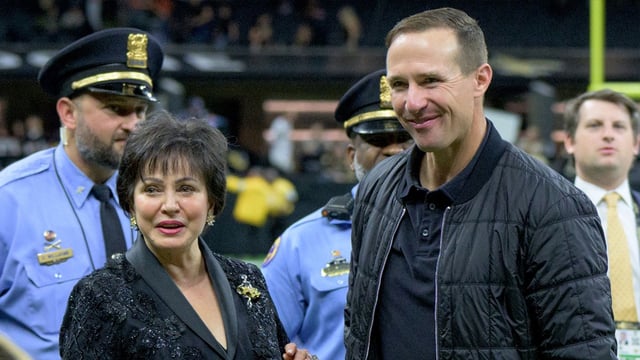 Nov 17, 2024; New Orleans, Louisiana, USA; New Orleans Pelicans and Saints owner Gayle Benson and former New Orleans Saints quarterback Drew Brees look on from the sideline before a game against the Cleveland Browns Caesars Superdome. Mandatory Credit: Matthew Hinton-Imagn Images