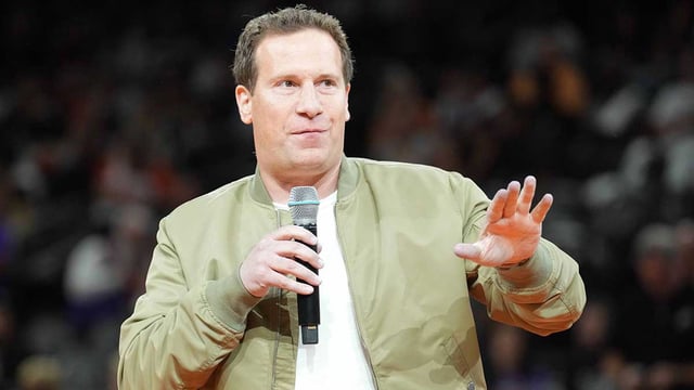 Oct 28, 2023; Phoenix, Arizona, USA; Phoenix Suns owner Matt Ishbia greets fans during a Ring of Honor half time ceremony of the game against the Utah Jazz at Footprint Center. Mandatory Credit: Joe Camporeale-Imagn Images