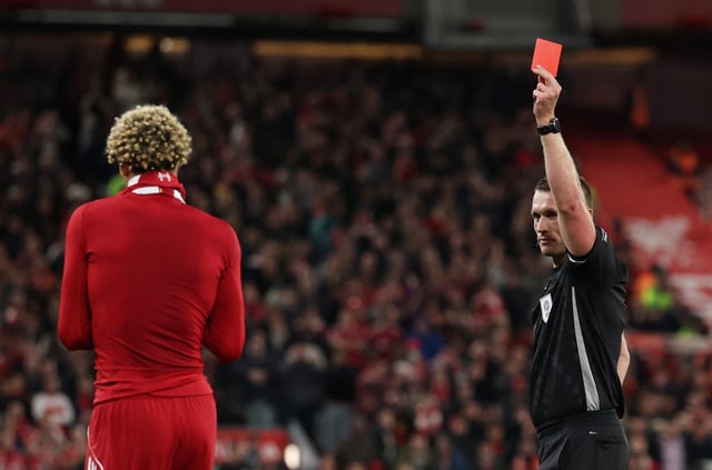 Soccer Football - Carabao Cup - Third Round - Liverpool v Southampton - Anfield, Liverpool, Britain - September 23, 2025 Liverpool's Hugo Ekitike is shown a red card by referee Thomas Bramall for receiving a second yellow card for removing his shirt after scoring their second goal REUTERS/Phil Noble