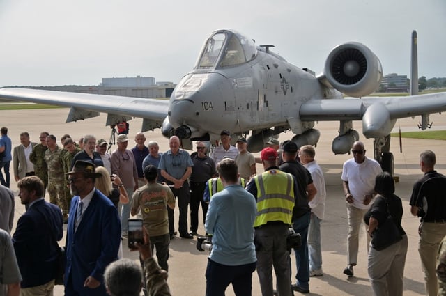 People gather around the one of the last A-10s after the Maryland Air National Guard inactivation ceremony for the  A-10 A-10C Thunderbolt II flying operations at Warfield Air National Guard Base at Martin State Airport. The last two A-10s will be transferred to the Michigan Air National Guard. (Kim Hairston/staff).