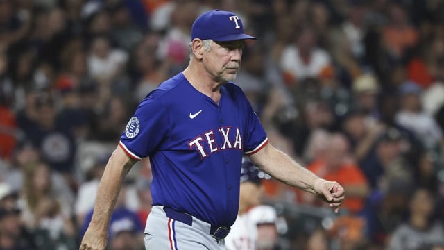 Sep 16, 2025; Houston, Texas, USA; Texas Rangers manager Bruce Bochy (15) walks to the mound for a pitching change during the fifth inning against the Houston Astros at Daikin Park. Mandatory Credit: Troy Taormina-Imagn Images