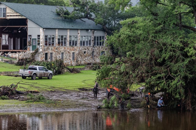 Search and rescue workers dig through debris looking for survivors of the July 4 flash flood that ravaged Camp Mystic.