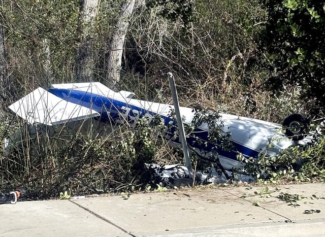 A plane crash near the Fallbrook airport sparked a small spot fire Tuesday afternoon. The pilot declined medical attention and no one on the ground was injured. (North County Fire Protection District)