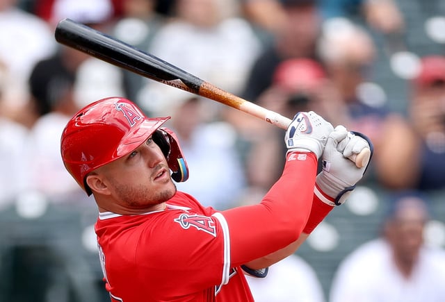 Angels star Mike Trout, shown hitting a double during the first inning of their game against the Colorado Rockies on Sunday in Denver, believes he knows the offensive adjustment he needs to make during the offseason and hopes to be back playing the outfield in 2026. (Photo by Matthew Stockman/Getty Images)