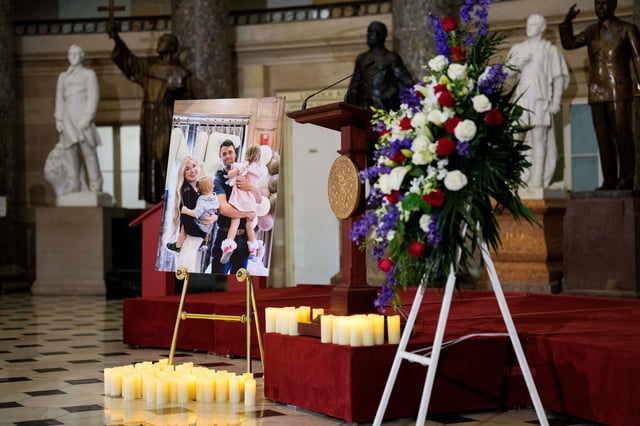 A photo of Charlie Kirk, his wife Erika Kirk and their two children is displayed following a vigil for Charlie Kirk in Statuary Hall of the U.S. Capitol in Washington DC, on Monday, September 15, 2025. Charlie Kirk, a right-wing influencer, was assassinated during an event in Utah last week. (Photo by Aaron Schwartz/Sipa USA)(Sipa via AP Images)