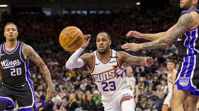 Apr 13, 2025; Sacramento, California, USA; Phoenix Suns guard Monte Morris (23) passes against the Sacramento Kings during the fourth quarter at Golden 1 Center. Mandatory Credit: John Hefti-Imagn Images
