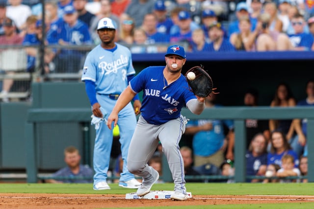 Sep 20, 2025; Kansas City, Missouri, USA; Toronto Blue Jays first base Ty France (2) reaches for a throw to first base during the second inning against the Kansas City Royals at Kauffman Stadium. Mandatory Credit: William Purnell-Imagn Images/File photo