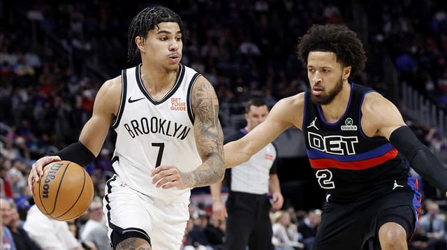 Mar 1, 2025; Detroit, Michigan, USA; Brooklyn Nets guard Killian Hayes (7) dribbles defended by Detroit Pistons guard Cade Cunningham (2) in the first half at Little Caesars Arena. Mandatory Credit: Rick Osentoski-Imagn Images